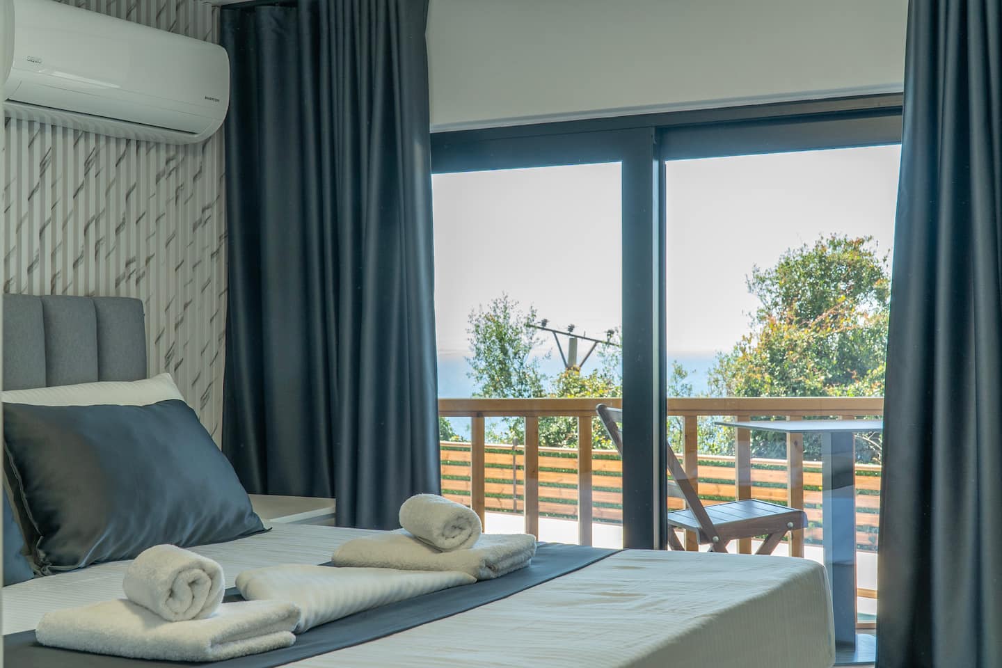 A restful bedroom with balcony access