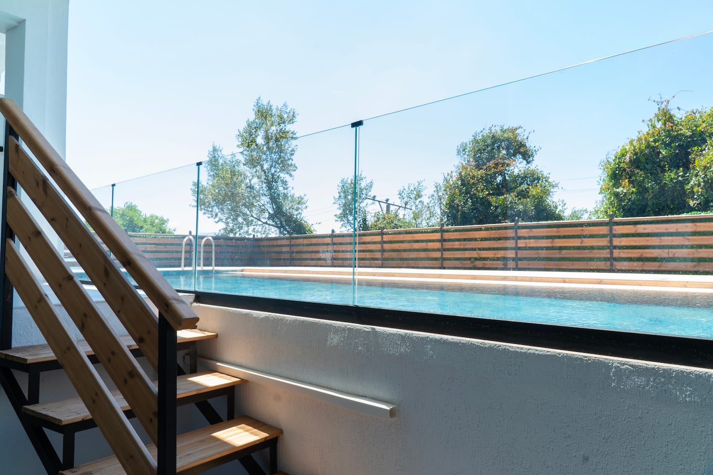 The terrace stairs leading down to the pool
